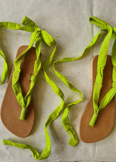 two untied handmade lime green lace up sandals