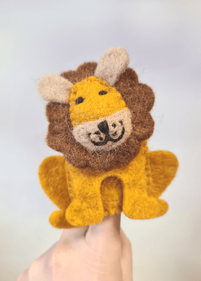 sitting felt yellow lion finger puppet with brown mane and smiley face sat on someone's finger