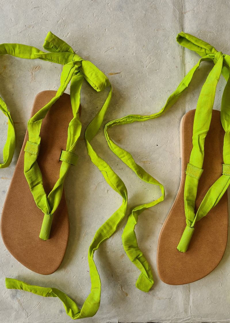 two untied handmade lime green lace up sandals 