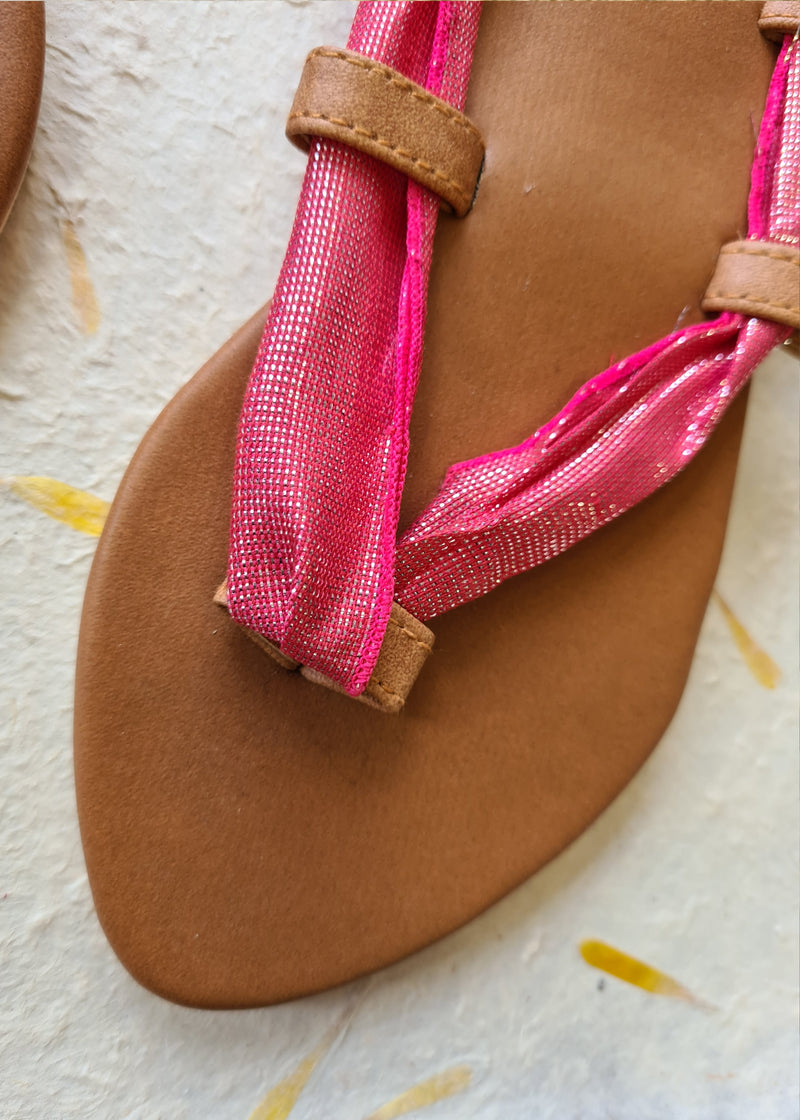 close up of the strap and vegan leather on pink metallic lace up sandal